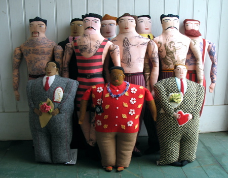 The “Big Men” are about 16 inches tall. The tattooed man design is about 23 